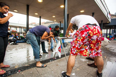 BUDAPEST - SEPTEMBER 4 : War refugees at the Keleti Railway Station on 4 September 2015 in Budapest, Hungary. Refugees are arriving constantly to Hungary on the way to Germany.のeditorial素材