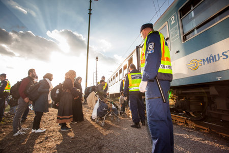 GYEKENYES- OCTOBER 5 : War refugees at the Gyekenyes Zakany Railway Station on 5 October 2015 in...