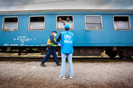 GYEKENYES- OCTOBER 6 : War refugees at the Gyekenyes Zakany Railway Station on 6 October 2015 in...