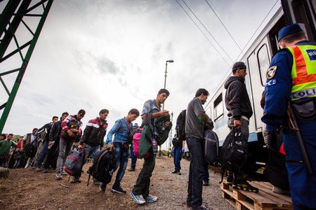 GYEKENYES- OCTOBER 6 : War refugees at the Gyekenyes Zakany Railway Station on 6 October 2015 in...