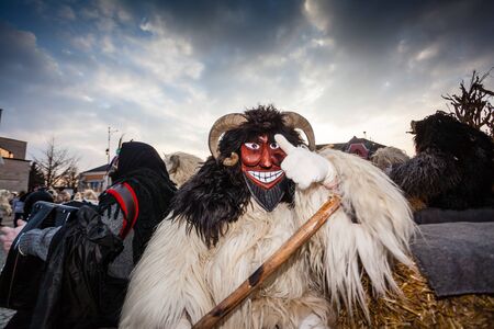 MOHACS, HUNGARY - FEBRUARY 17: Unidentified people in mask participants at the Mohacsi Busojaras, it is a carnival for spring greetings) February 17, 2015 in Mohacs, Hungary.のeditorial素材