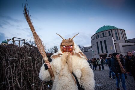 MOHACS, HUNGARY - FEBRUARY 17: Unidentified people in mask participants at the Mohacsi Busojaras, it is a carnival for spring greetings) February 17, 2015 in Mohacs, Hungary.のeditorial素材