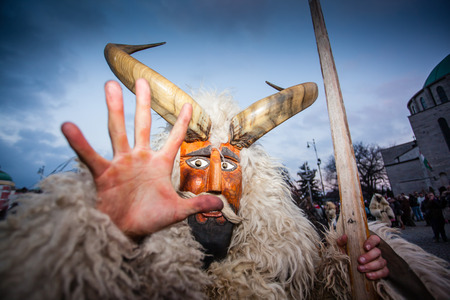 MOHACS, HUNGARY - FEBRUARY 17: Unidentified people in mask participants at the Mohacsi Busojaras, it is a carnival for spring greetings) February 17, 2015 in Mohacs, Hungary.のeditorial素材