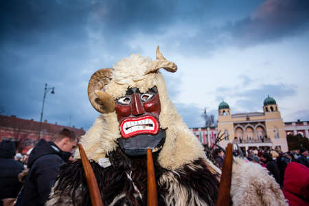 MOHACS, HUNGARY - FEBRUARY 17: Unidentified people in mask participants at the Mohacsi Busojaras, it is a carnival for spring greetings) February 17, 2015 in Mohacs, Hungary.のeditorial素材
