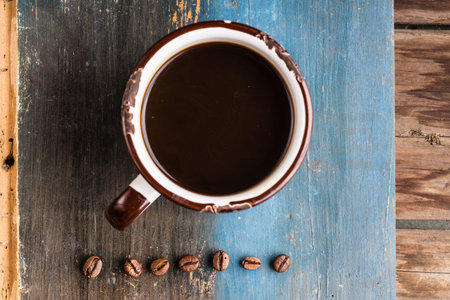 a cup of coffee on old wooden background