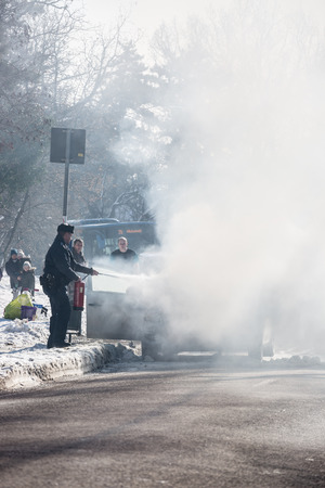 PECS, HUNGARY - JANUARY 21: Burning Car on road Pecs in wintertime, Hungary on January 21, 2017.のeditorial素材