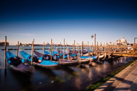 view of the Church of San Giorgio Maggiore on the island of the San Giorgio Maggiore with gondolas, Venice, Italyの写真素材