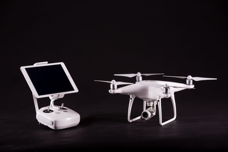 PECS, BARANYA, HUNGARY - MARCH 1, 2017: Brand new DJI Phantom 4 pro quadcopter drone with controller...