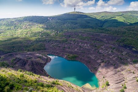 Aerial view, deep mine lake in place of a mining pitの写真素材