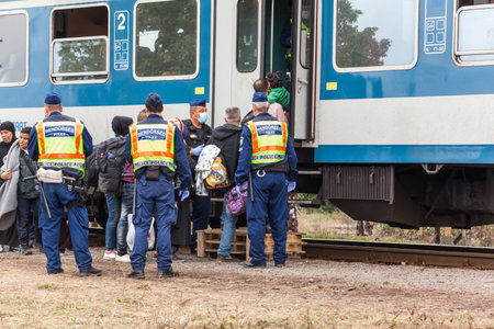 GYEKENYES- OCTOBER 6 : War refugees at the Gyekenyes Zakany Railway Station on 6 October 2015 in...