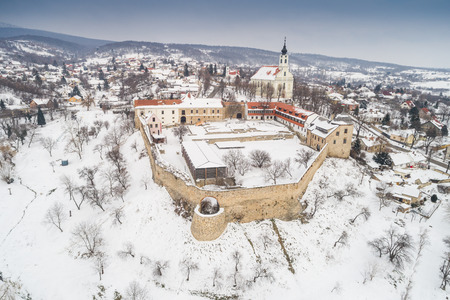 Beautiful church with fortress of Pecsvarad, Hungary at winterのeditorial素材