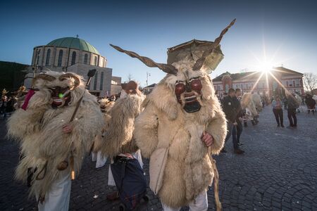 MOHACS, HUNGARY - MARCH 5: Unidentified people in mask participants at the Mohacsi Busojaras, it is a carnival for spring greetings March 5, 2019 in Mohacs, Hungaryのeditorial素材