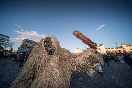 MOHACS, HUNGARY - MARCH 5: Unidentified people in mask participants at the Mohacsi Busojaras, it is a carnival for spring greetings March 5, 2019 in Mohacs, Hungaryのeditorial素材