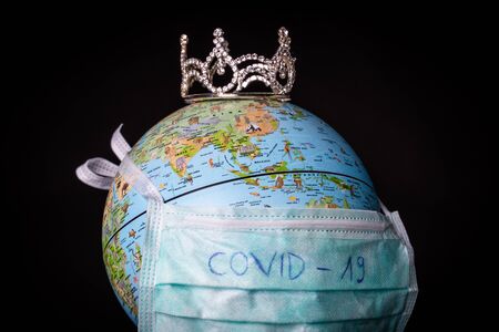 medical mask on a globe for coronavirus protectionの写真素材