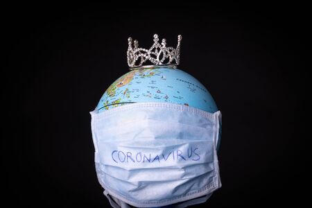 medical mask on a globe for coronavirus protectionの写真素材