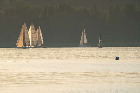 ZAMARDI - JULY 29: Sailing boats compete on the 52nd Blue Ribbon Championship at the Lake Balaton on 29 July 2020 in Zamardi, Hungary.のeditorial素材