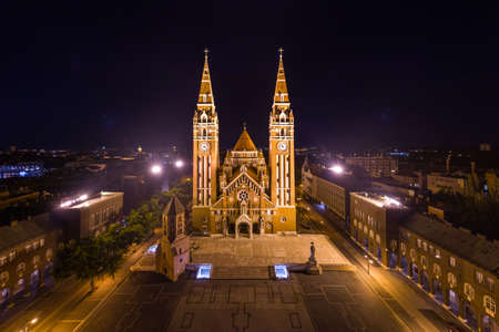 aerial photo of beautiful Cathedral of Szeged at nightの写真素材