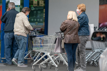 PECS - MAY 27: Old people go shopping on the street on May 27, 2020 in Pecs, Hungary. During...