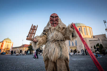 MOHACS, HUNGARY - FEBRUARY 14: Unidentified person wearing mask for spring greetings. In this year during the COVID pandemic the public Busojaras event was canceled. February 14, 2021 in Mohacs, Hungary.のeditorial素材