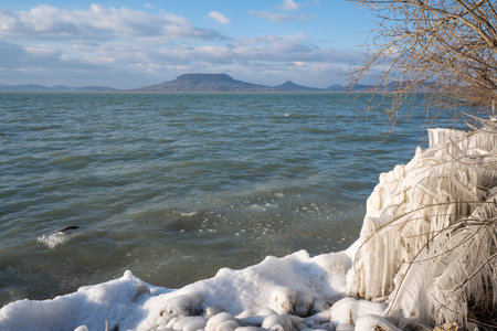 Beautiful frozen Lake Balaton with steel stepsの写真素材