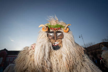 MOHACS, HUNGARY - FEBRUARY 14: Unidentified person wearing mask for spring greetings. In this year during the COVID pandemic the public Busojaras event was canceled. February 14, 2021 in Mohacs, Hungary.のeditorial素材