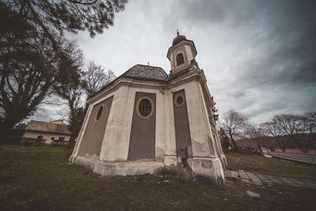 Small chapel with stormy clouds, before rainの写真素材