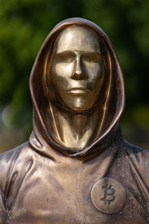Budapest, Hungary - August 7, 2022: Portrait of the statue of Satoshi Nakamoto mysterious founder of Bitcoin and Blockchain technology in; created by Reka Gergely and Tamas Gilly. August 7, 2022 in Budapest, Hungary.のeditorial素材