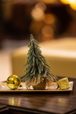 Gold christmas decoration on a tableの写真素材