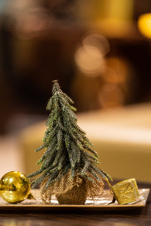 Gold christmas decoration on a tableの写真素材