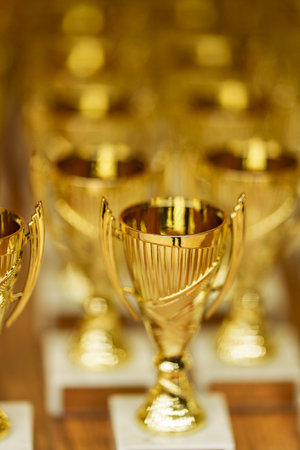 lots of gold cups rewarding winnersの写真素材