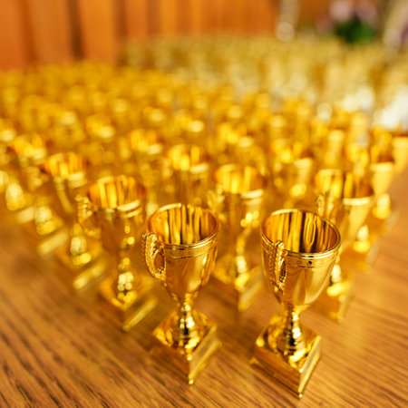 lots of gold cups rewarding winnersの写真素材