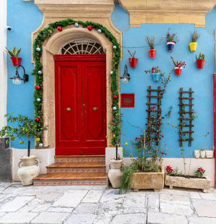 Traditional house detail in Malta. Limestone yellow bricks and colorful balconies, windowsの写真素材