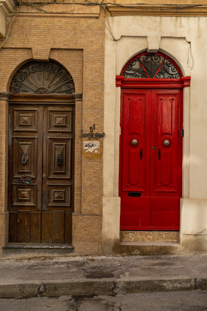 Traditional house detail in Malta. Limestone yellow bricks and colorful balconies, windowsの写真素材