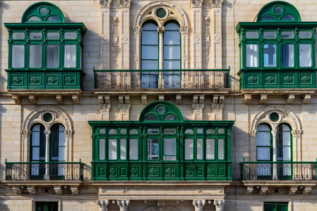 Traditional house detail in Malta. Limestone yellow bricks and colorful balconies, windowsの写真素材
