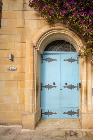 Traditional house detail in Malta. Limestone yellow bricks and colorful balconies, windowsの写真素材