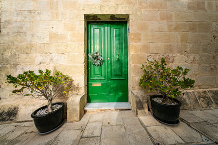 Traditional house detail in Malta. Limestone yellow bricks and colorful balconies, windowsの写真素材