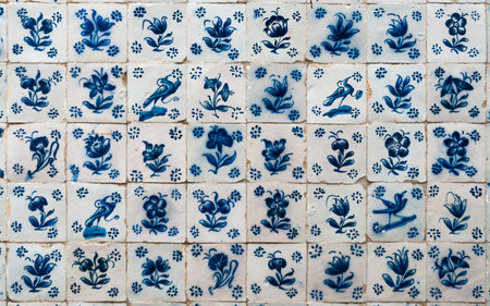 Wall with Portuguese ancient pottery in blue tones