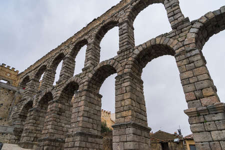 Partial view of the arches of the Roman Aqueduct of Segovia, in Spain.の写真素材