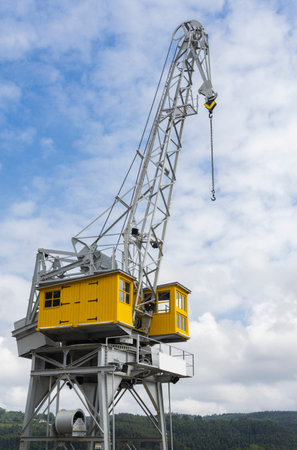 Vertical view of a port crane in the old industrial area of ?? the town of San Esteban de Pravia in...