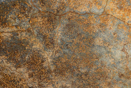 Wall of an old construction with a lot of texture and in warm color tones.の写真素材