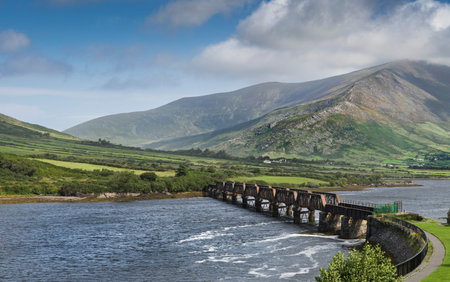 Irish rural landscape near the village of Cahersiveen in southern Ireland. With an iron bridge across the canal.の写真素材
