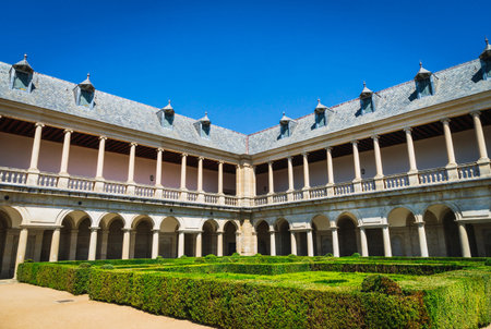 Herrerian style cloister and part of the gardens of the Monastery of San Lorenzo de el Escorial.