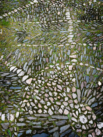 View of a floor of small stones with geometric shapes and a lot of texture.の写真素材