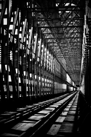 Old rusty metal railway bridge, black and whiteの写真素材