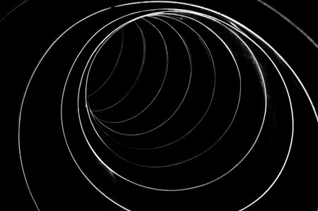Black and white abstract swirls in a big metal tube