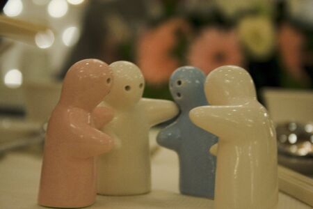 Figurines discussing on a dinner tableの写真素材