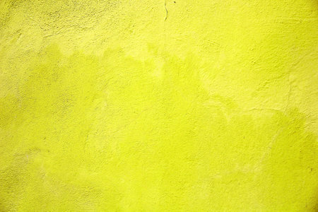 Bright Neon Yellow Grunge Wall Texture Backgroundの写真素材