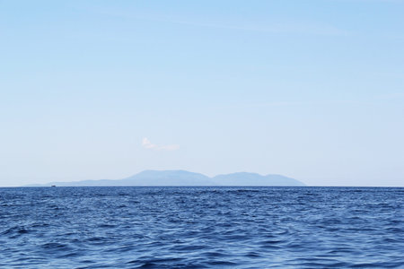 Distant Croatian Island in with Sea and Skyの写真素材