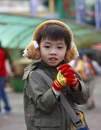 Smiling kid with ear muffs 1の写真素材