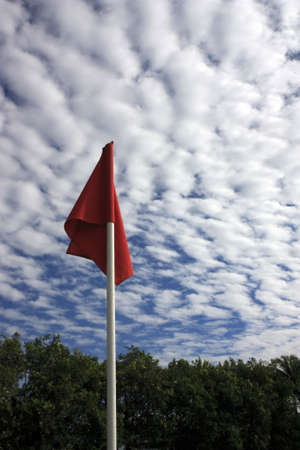 Soccer coner flag against cloudy skyの写真素材